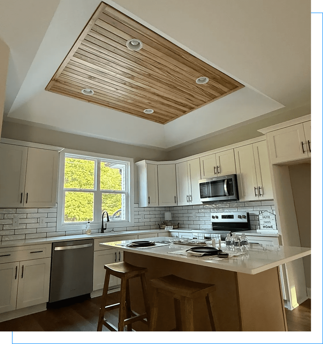 Modern kitchen island under wooden ceiling inset